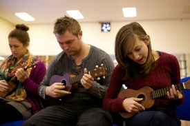 Students learn to play ukuleles